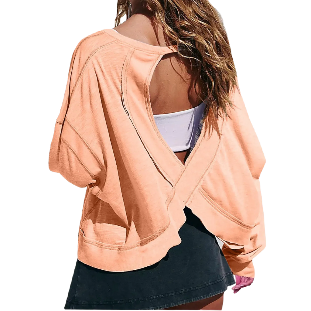 Xooie Fit women's backless workout top in orange with unique cross-back design and long sleeves