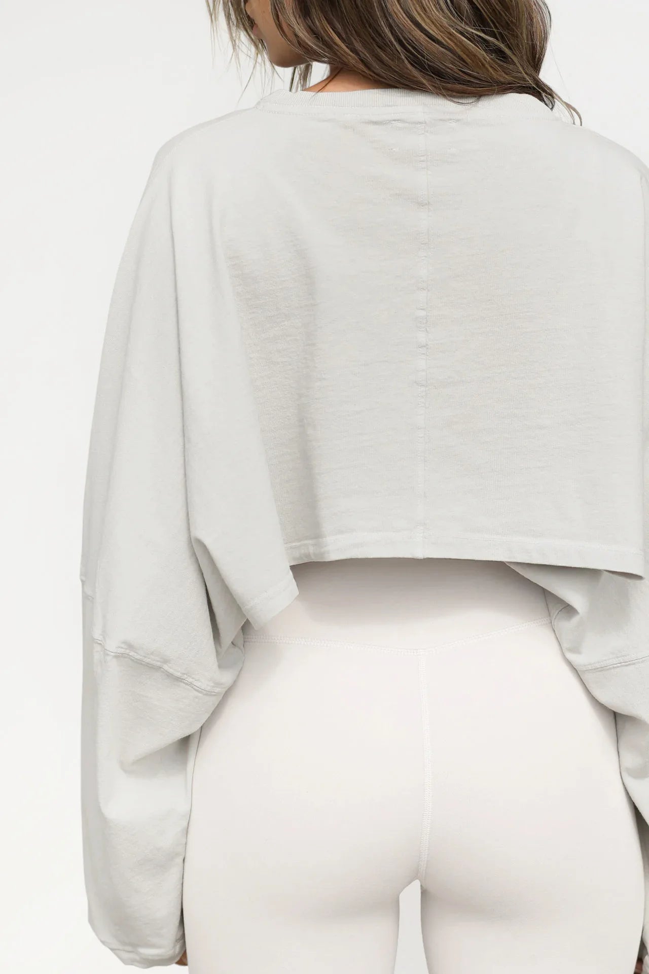 Light gray women's baggy crop top with long sleeves and relaxed fit from Xooie Fit