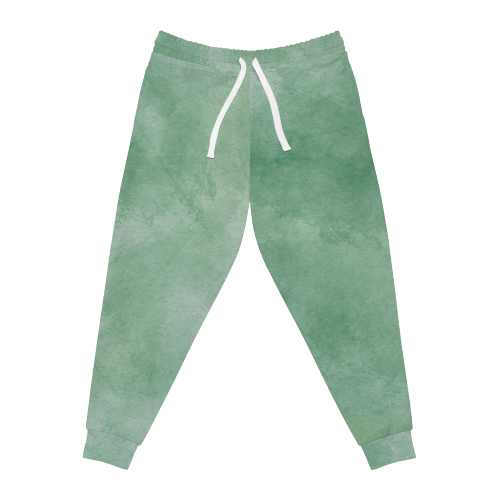 Green-teal watercolor joggers with white drawstring and cuffed ankles