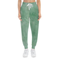 Green watercolor athletic joggers with white drawstring and ribbed ankle cuffs