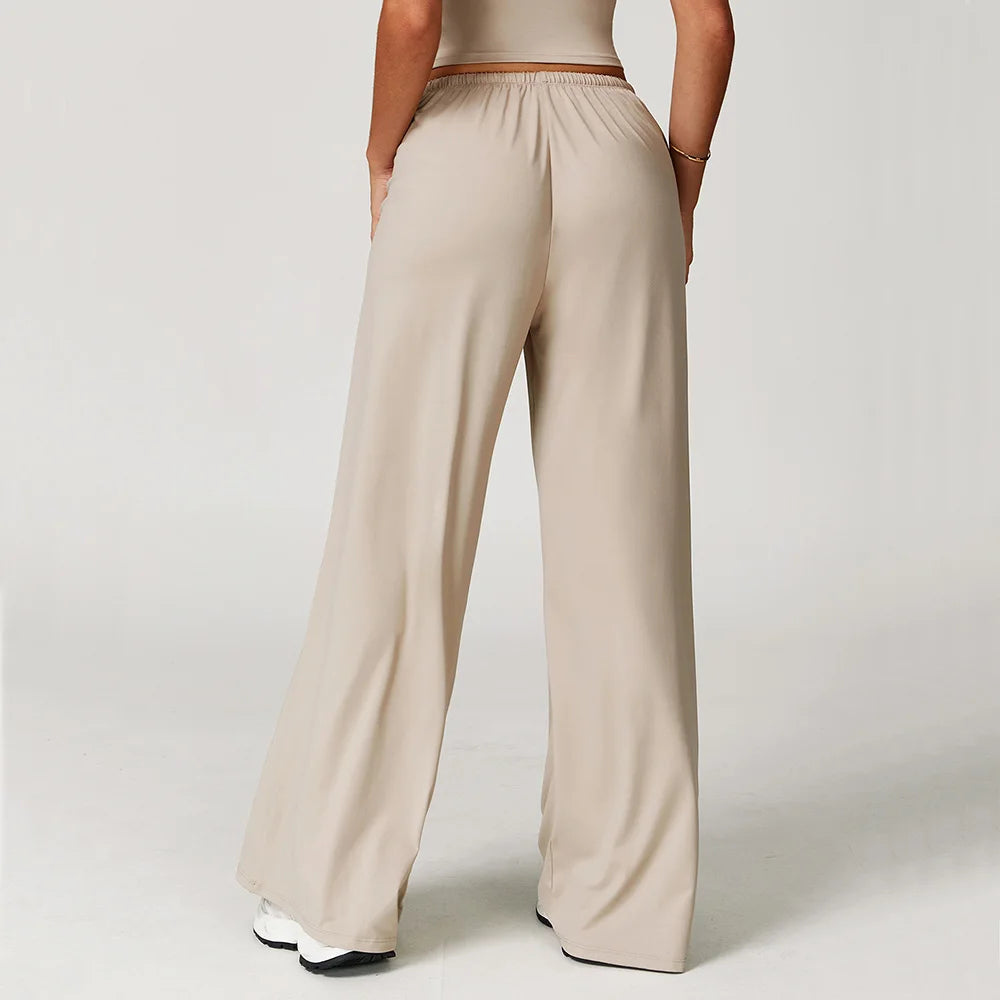 Xooie Fit women's baggy workout pants in beige with a comfortable elastic waistband