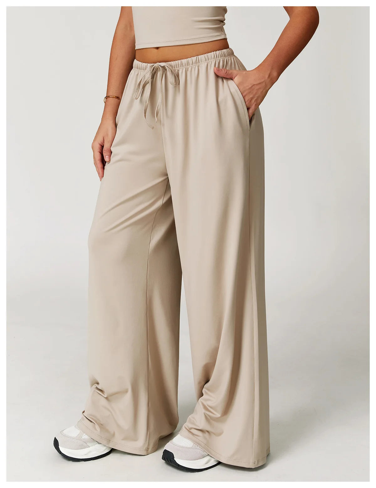Xooie Fit women's baggy workout pants in beige with side pockets for comfortable exercise