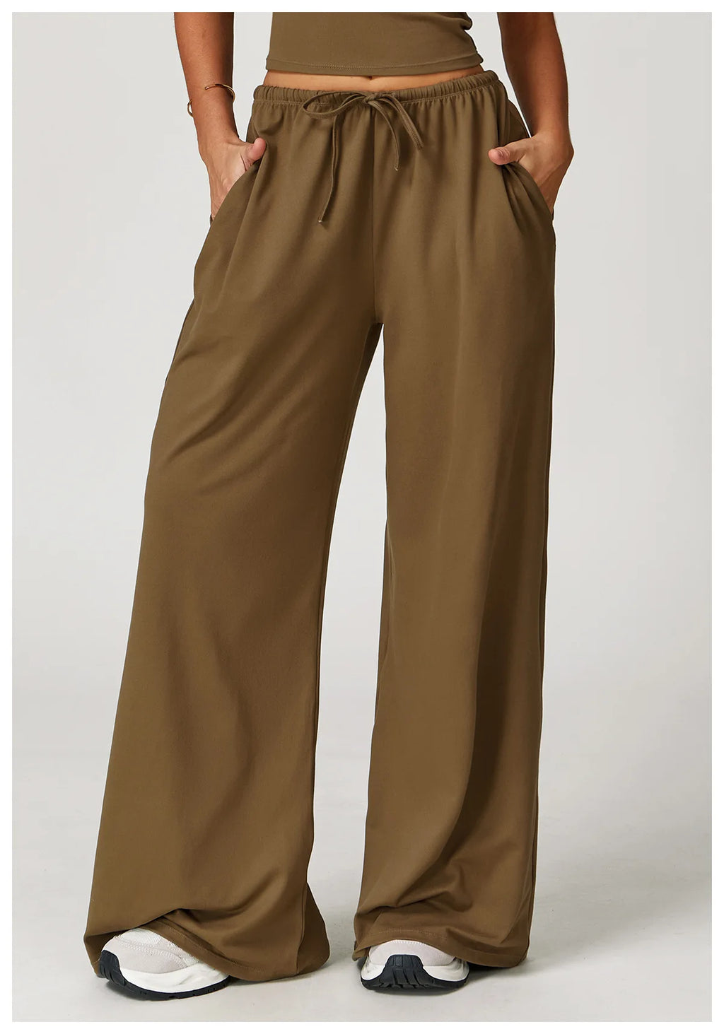 Xooie Fit women's baggy workout pants in olive green with a drawstring and pockets for comfort
