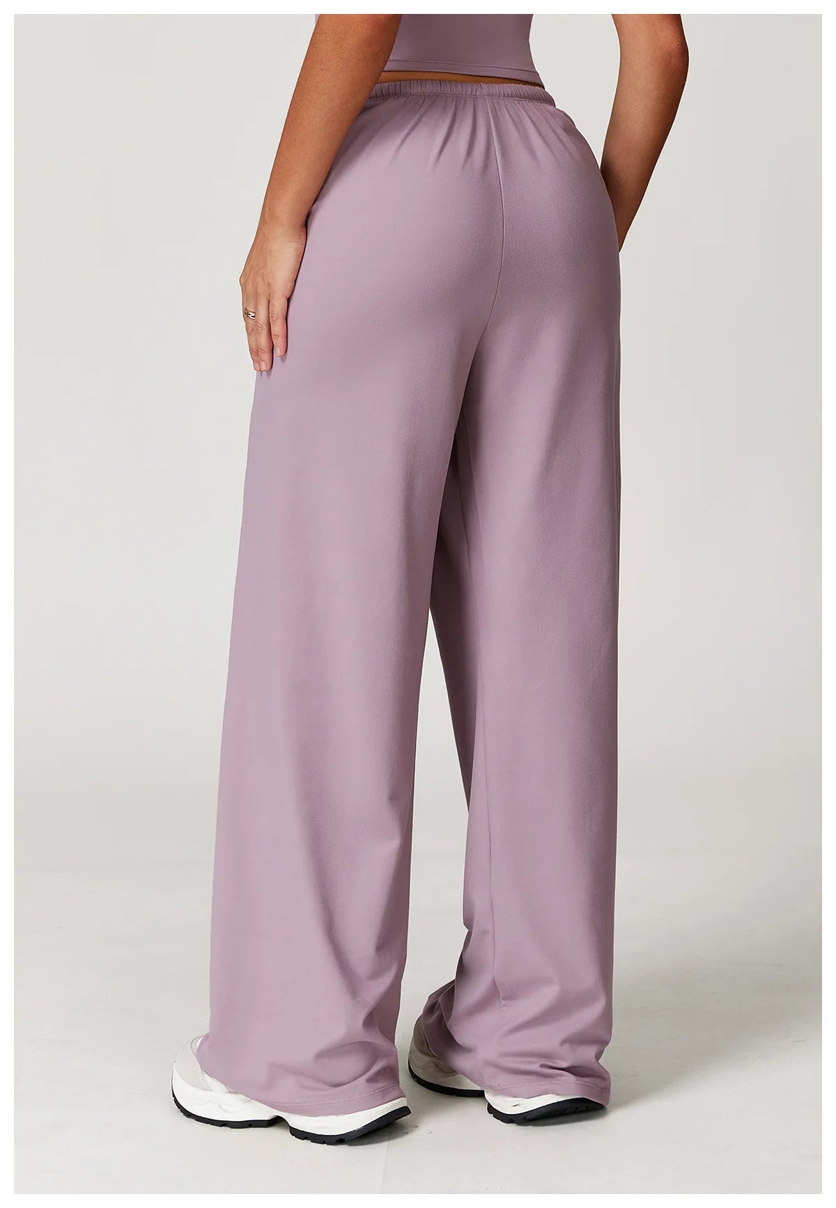 Xooie Fit women's baggy workout pants in soft lavender with an elastic waistband for comfort