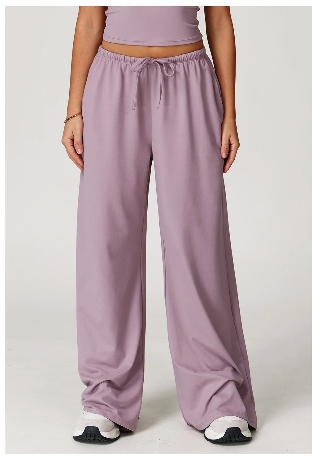 Xooie Fit women's baggy workout pants in soft lavender color with a relaxed fit