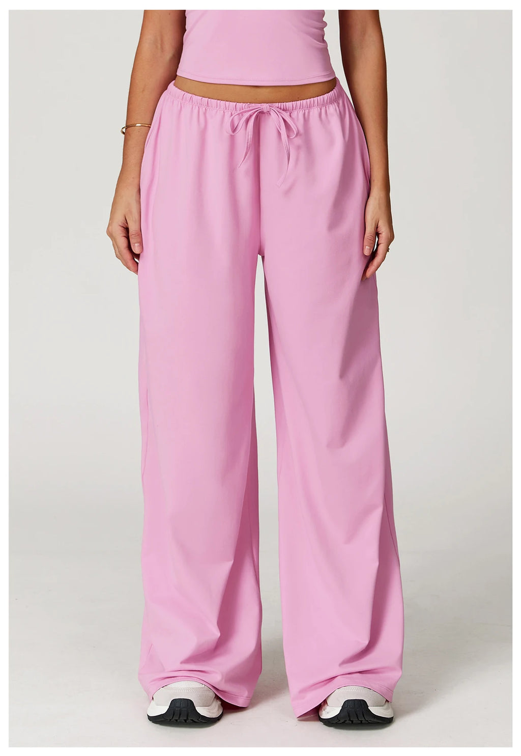 Xooie Fit women's baggy workout pants in pink with a relaxed fit for comfort during exercise close up