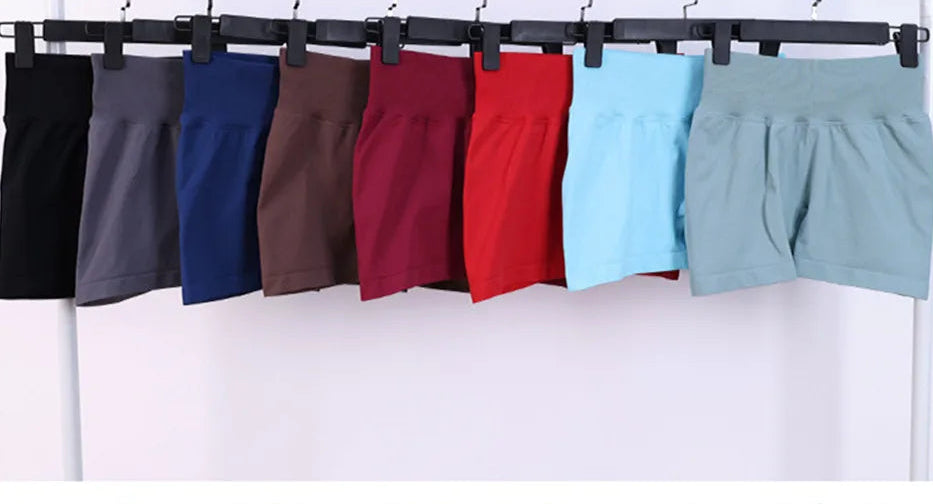 Assorted womens bra shorts active outfit in various colors hanging on display racks