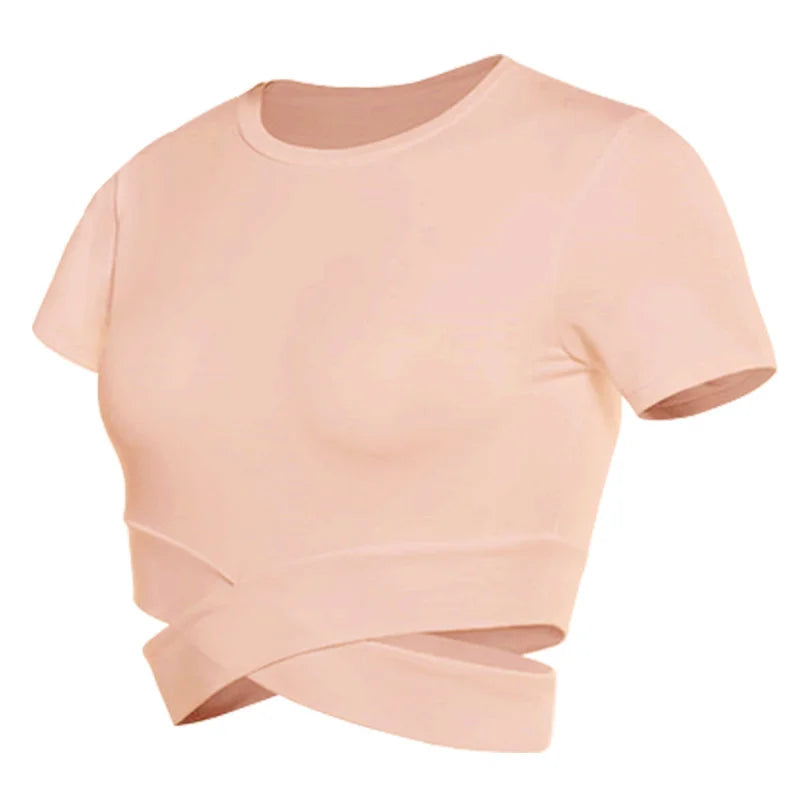 Xooie Fit women's criss-cross crop top in soft pink for stylish comfort and versatility