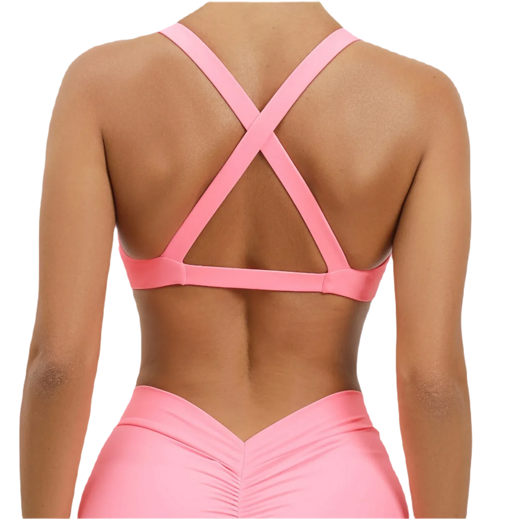 Xooie Fit women's fitness bralette in pink with stylish cross-back design for workout comfort