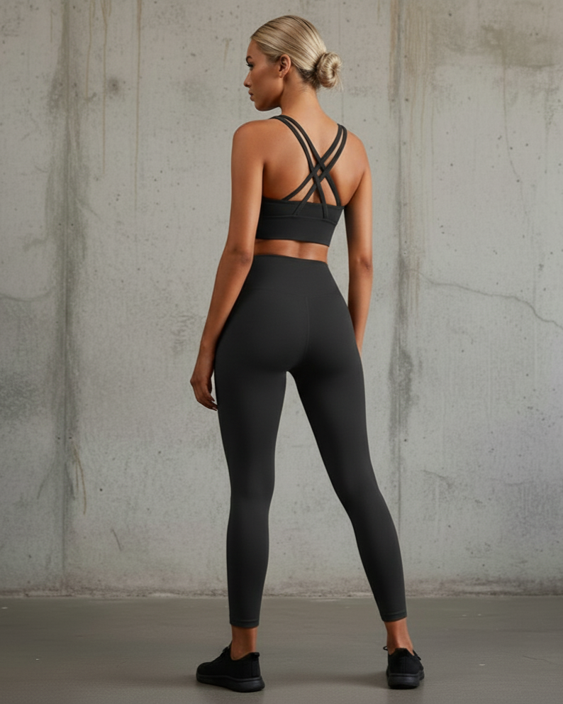 Xooie Fit women's fitness clothing set featuring a sleek black sports bra and matching high-waisted leggings