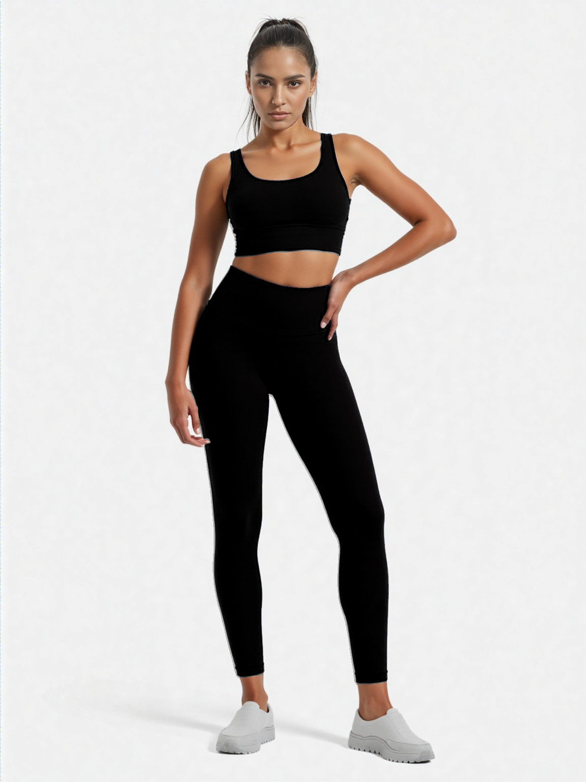 Xooie Fit women's fitness clothing set in black, featuring a crop top and high-waisted leggings