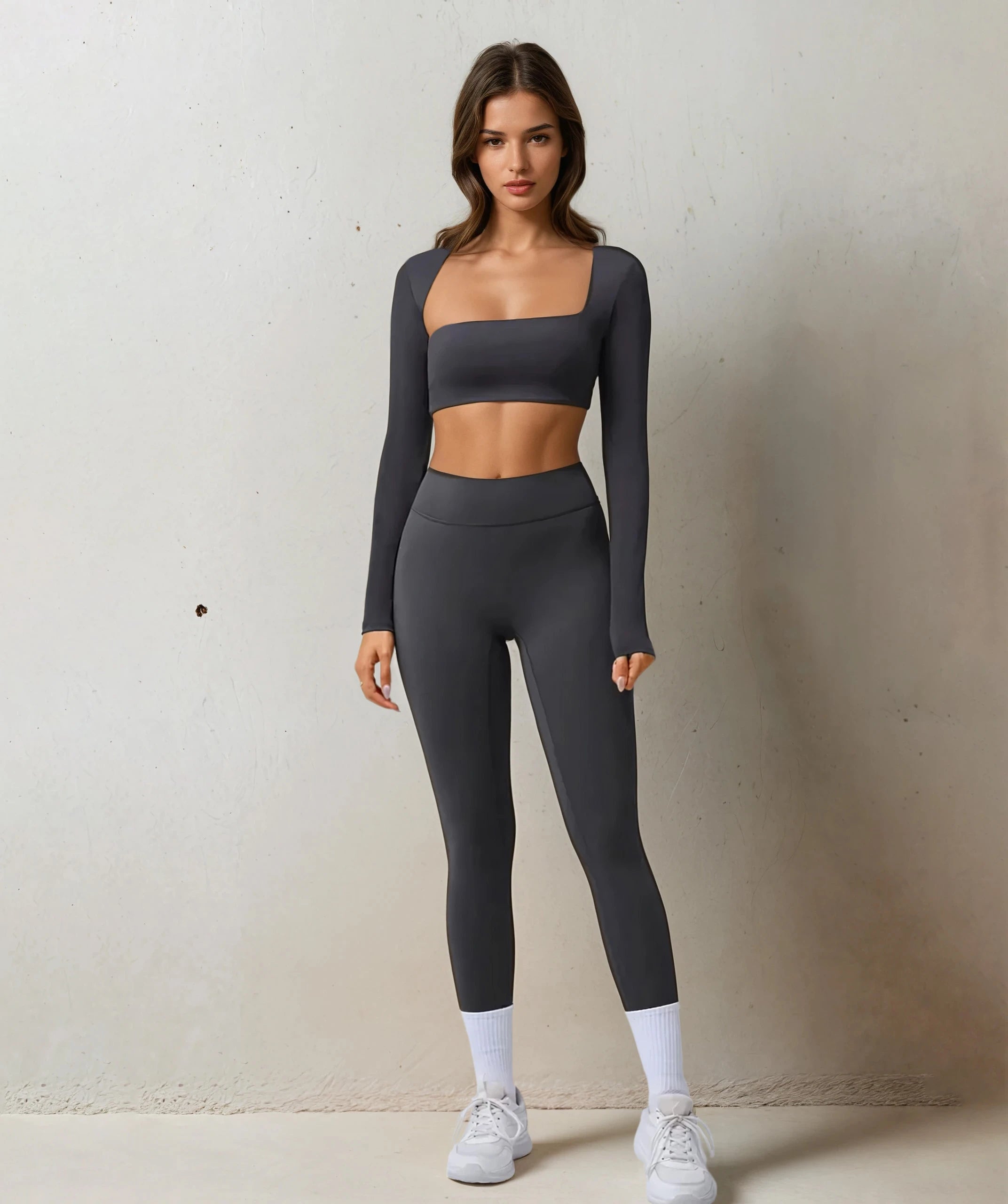 Xooie Fit women's fitness clothing set in dark gray featuring a cropped top and high-waisted leggings
