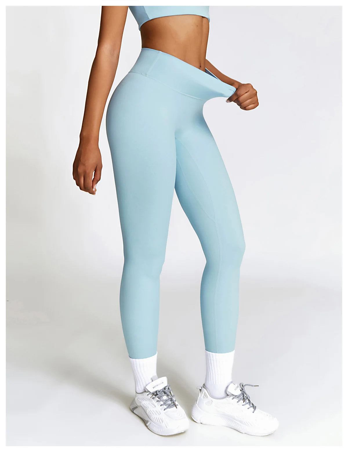 Xooie Fit Women's Fitness Clothing Set in Light Blue with Stylish Leggings and Supportive Sports Bra