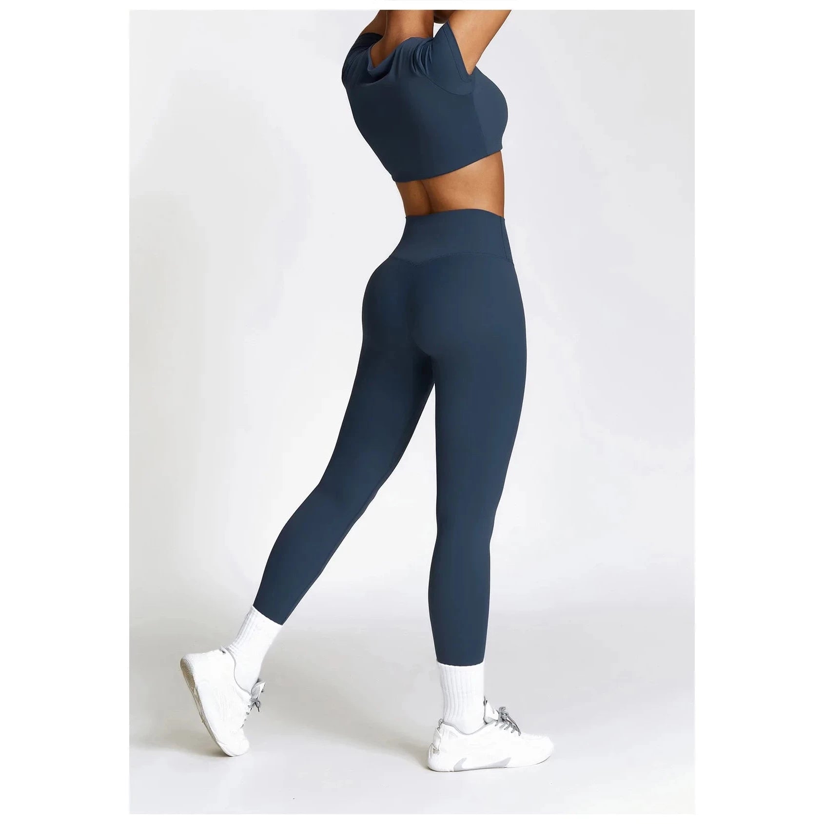 Xooie Fit women's fitness clothing set with a fitted crop top and leggings in dark blue