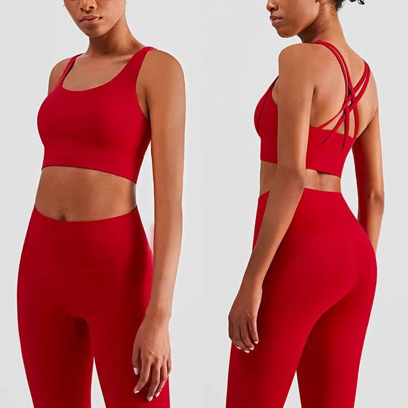Xooie Fit women's fitness clothing set in red featuring a stylish crop top and high-waisted leggings