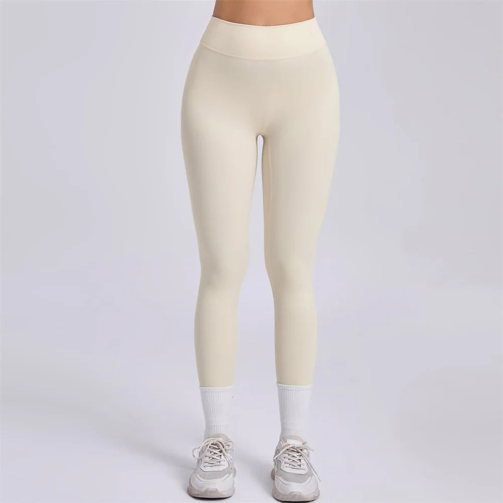 Xooie Fit women's fitness clothing set featuring high-waisted leggings in a soft beige color