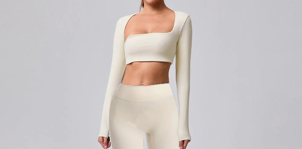 Xooie Fit women's fitness clothing set in cream featuring a crop top and high-waisted leggings