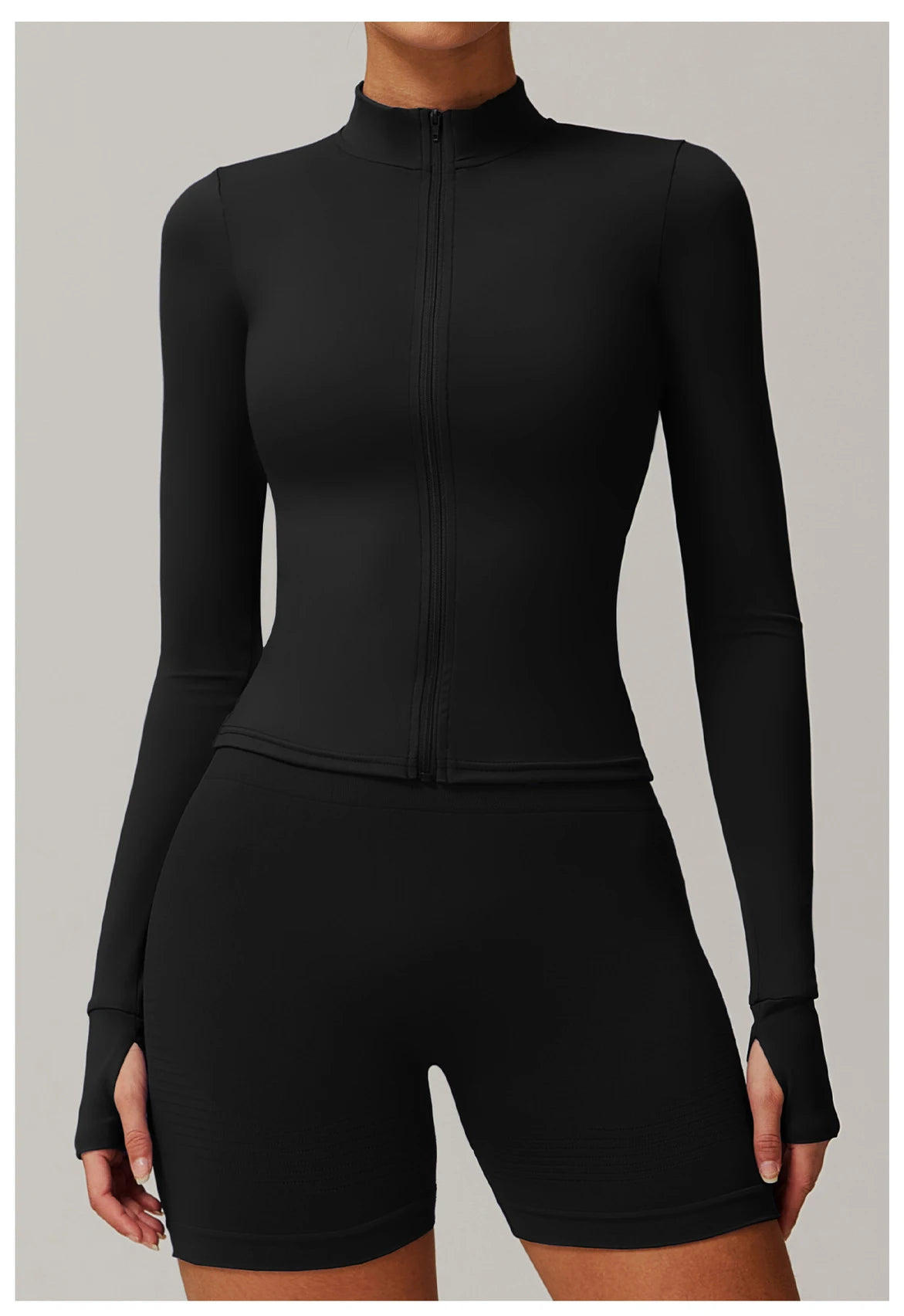 Xooie Fit women's fitness jacket with thumb holes in black with full zip and fitted design