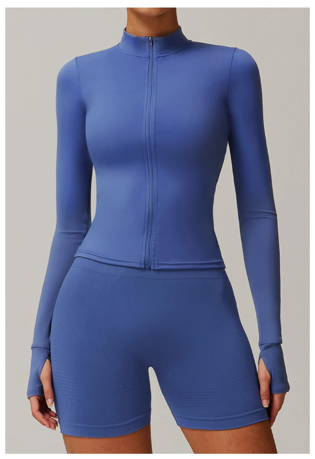 Xooie Fit women's fitness jacket with thumb holes in blue full-zip long sleeve lightweight design