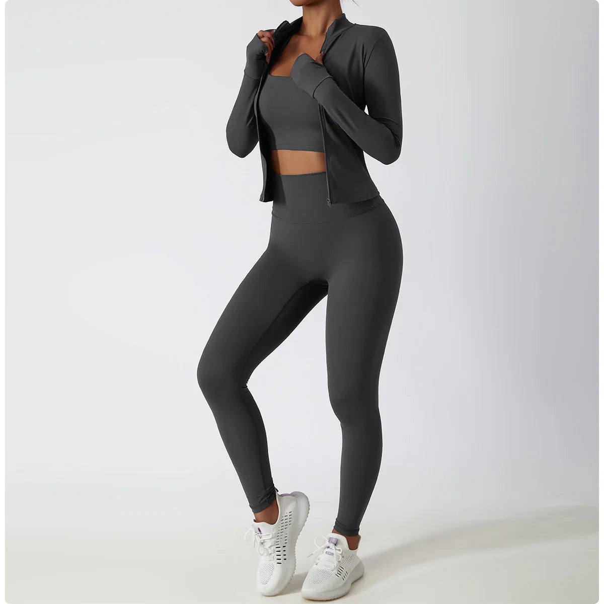 Xooie Fit women's fitness jacket with thumb holes in grey, paired with matching grey leggings