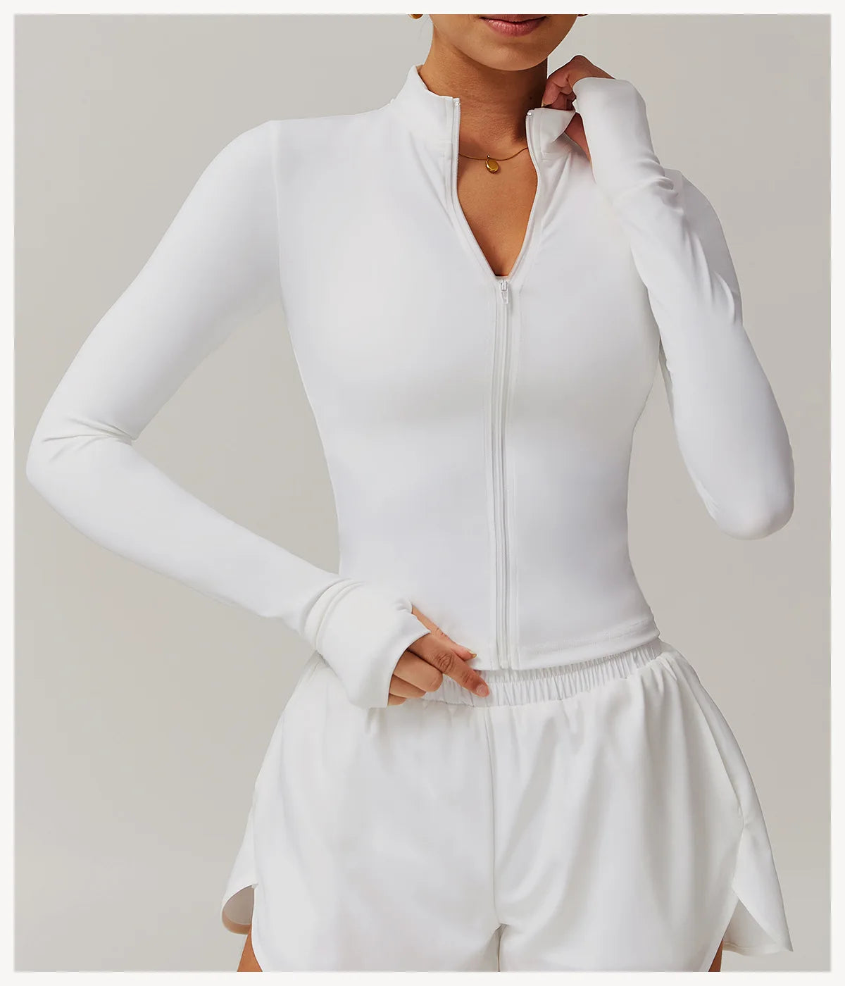Xooie Fit white women's fitness jacket with thumb holes and front zipper for active wear