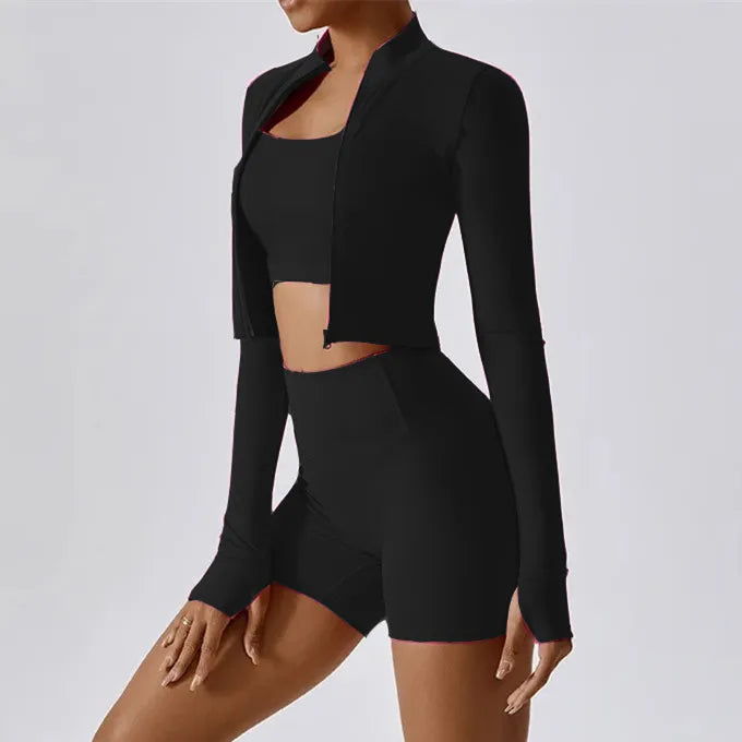 Xooie Fit women's fitness matching set featuring a cropped jacket, sports bra, and high-waisted shorts in black