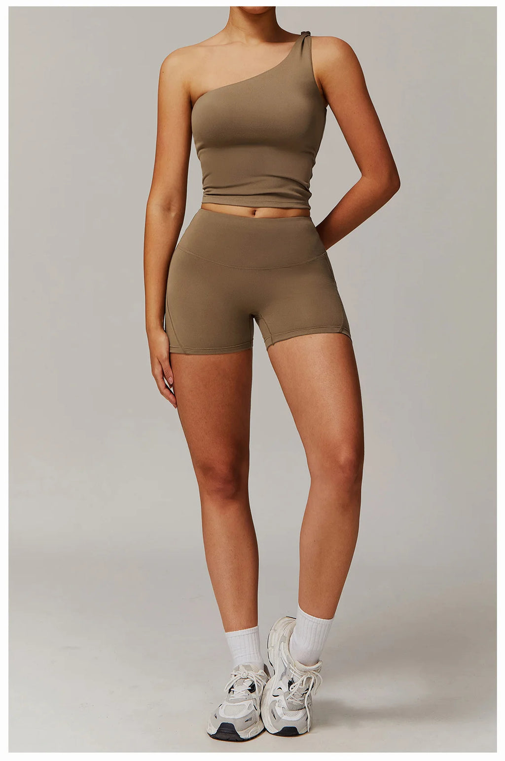 Xooie Fit women's fitness matching set with one-shoulder crop top and high-waisted shorts in olive