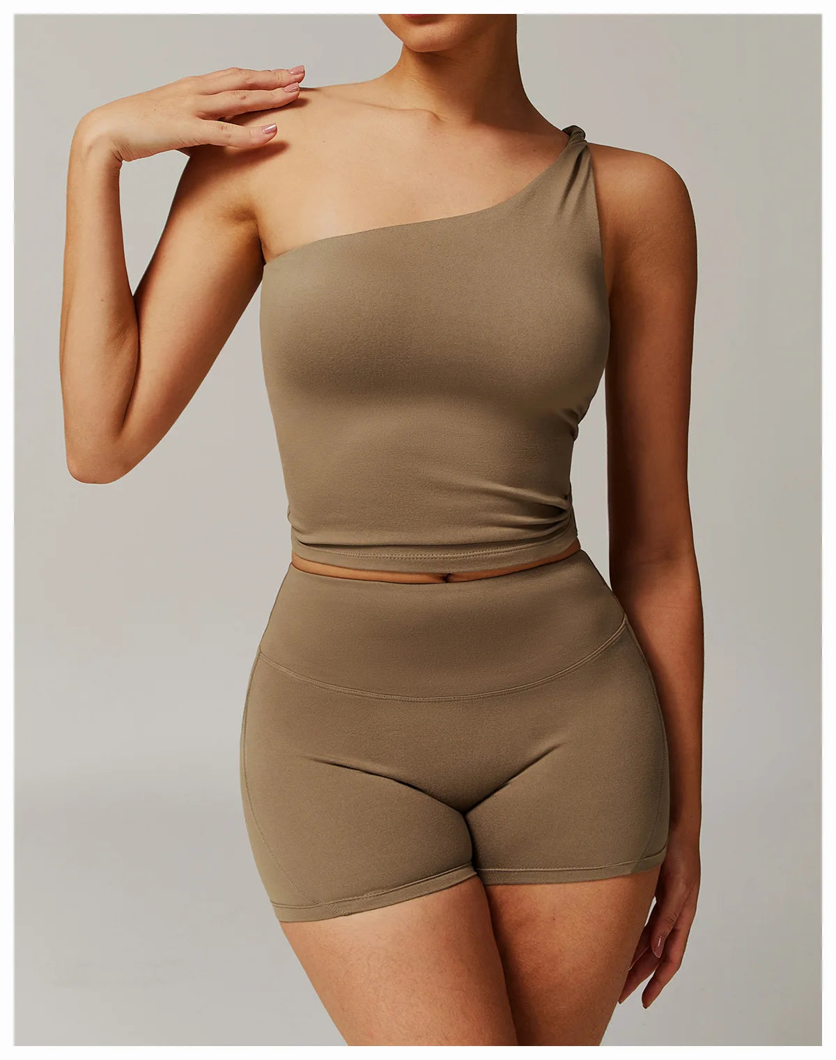 Xooie Fit women's fitness matching set in olive green with one-shoulder crop top and high-waisted shorts