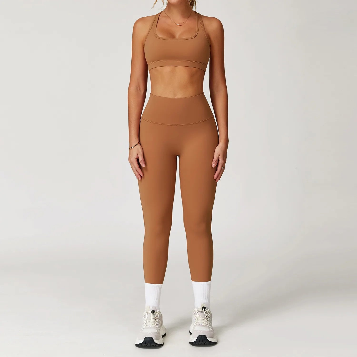 Xooie Fit women's fitness matching set in brown with high-waisted leggings and a sports bra