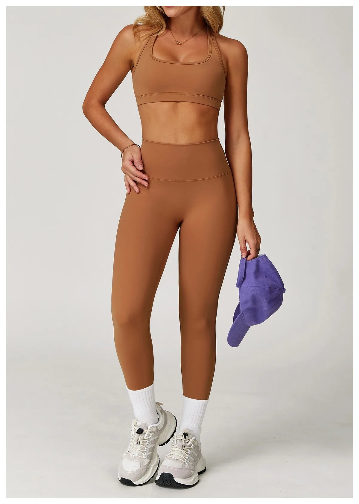 Xooie Fit women's fitness matching set in brown with a crop top and high-waisted leggings
