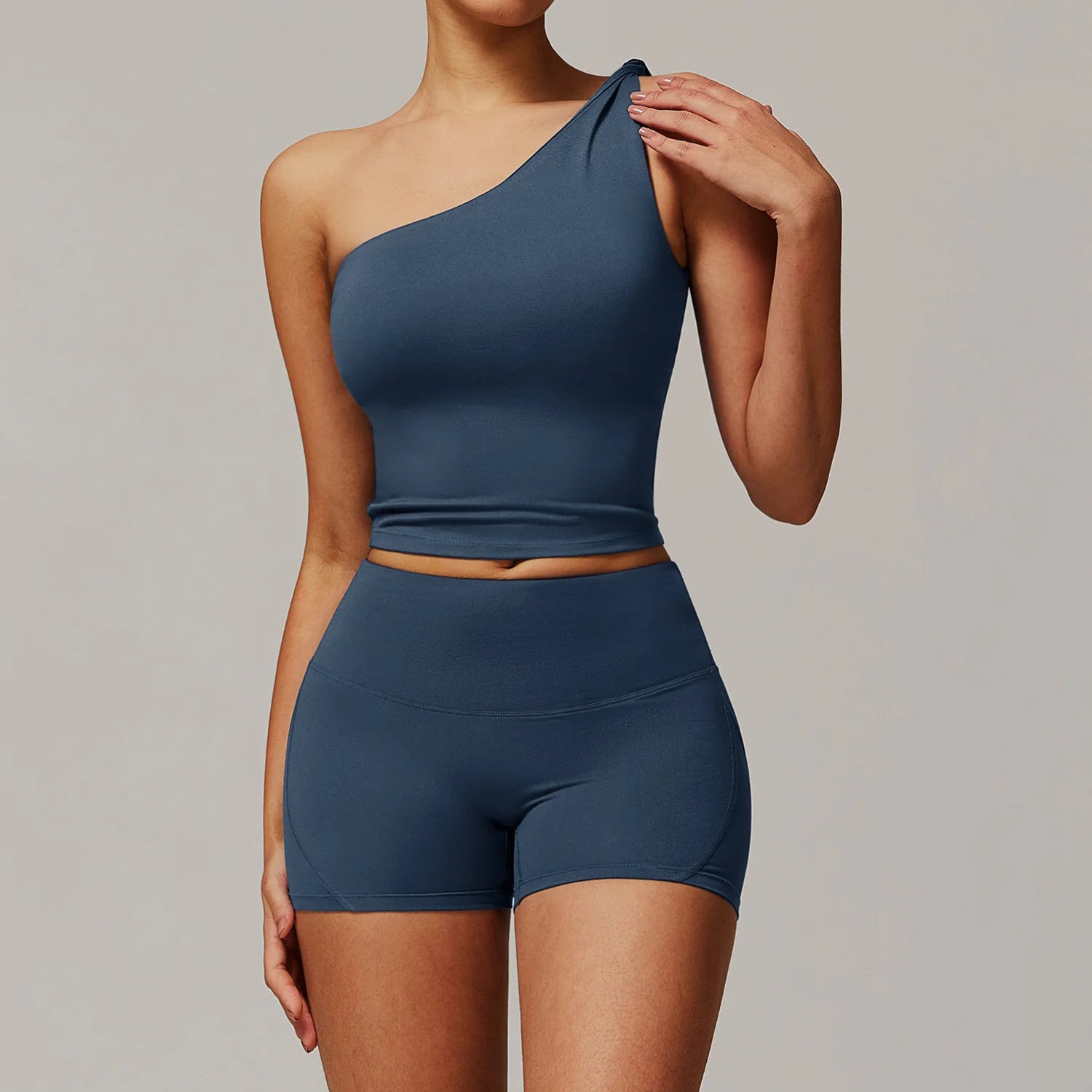Xooie Fit women's fitness matching set with one-shoulder crop top and high-waisted shorts in blue2