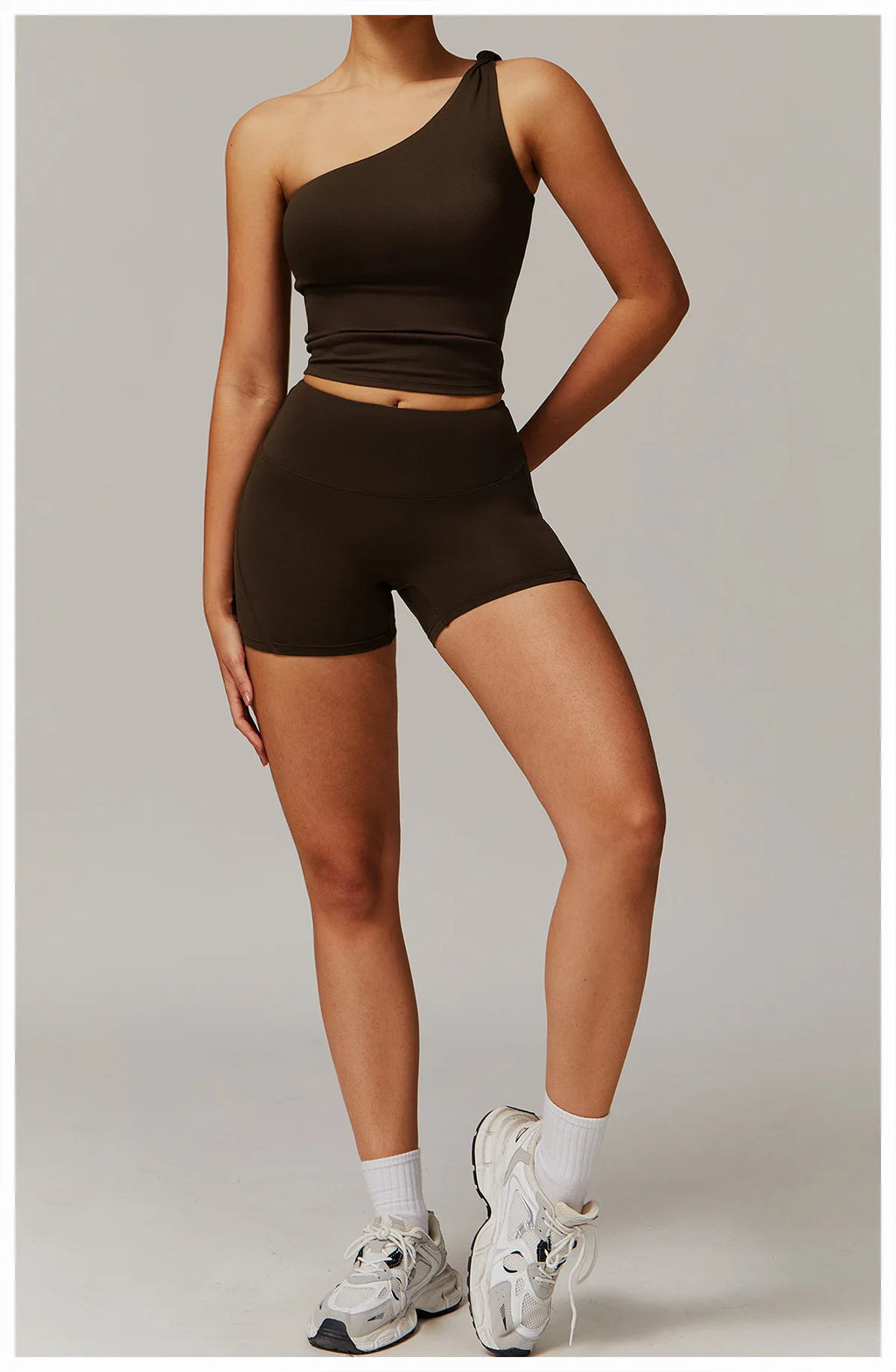 Xooie Fit women's fitness matching set with one-shoulder top and high-waisted shorts in dark brown