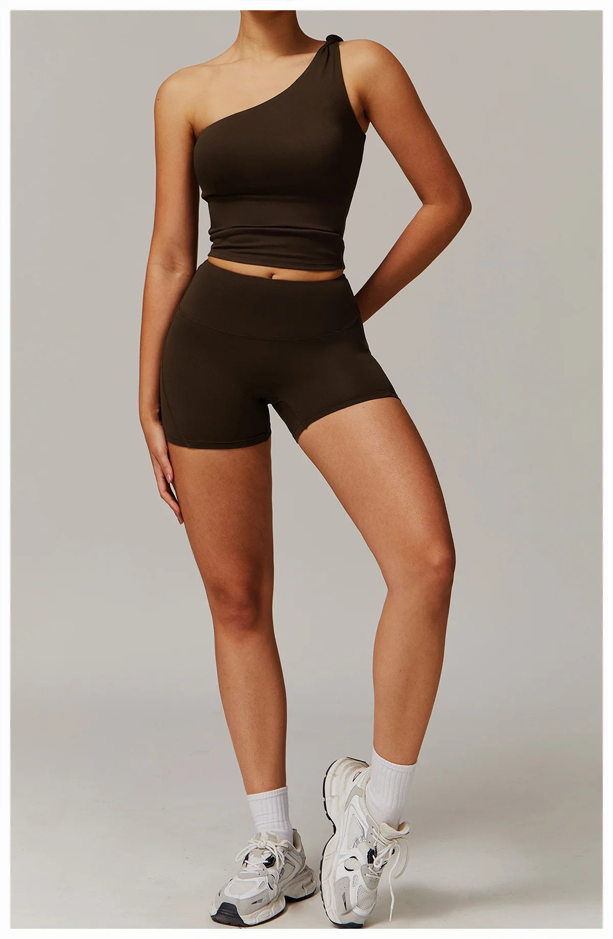 Xooie Fit women's fitness matching set with one-shoulder top and high-waisted shorts in dark brown