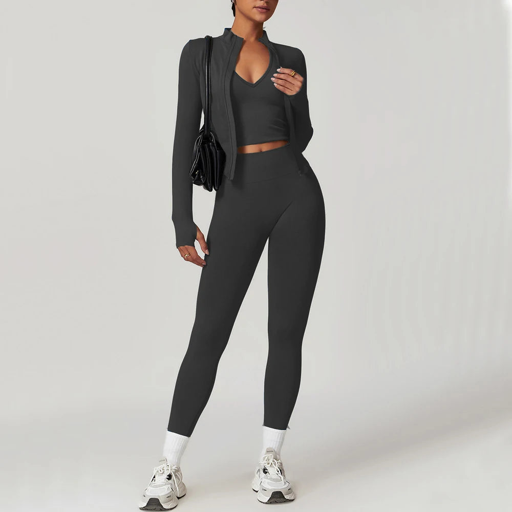 Xooie Fit women's fitness matching set in dark gray featuring a cropped top, high-waisted leggings, and a zip-up jacket