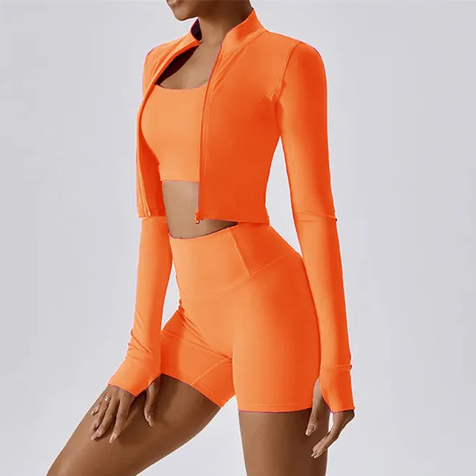 Xooie Fit women's fitness matching set in bright orange with long sleeves and shorts