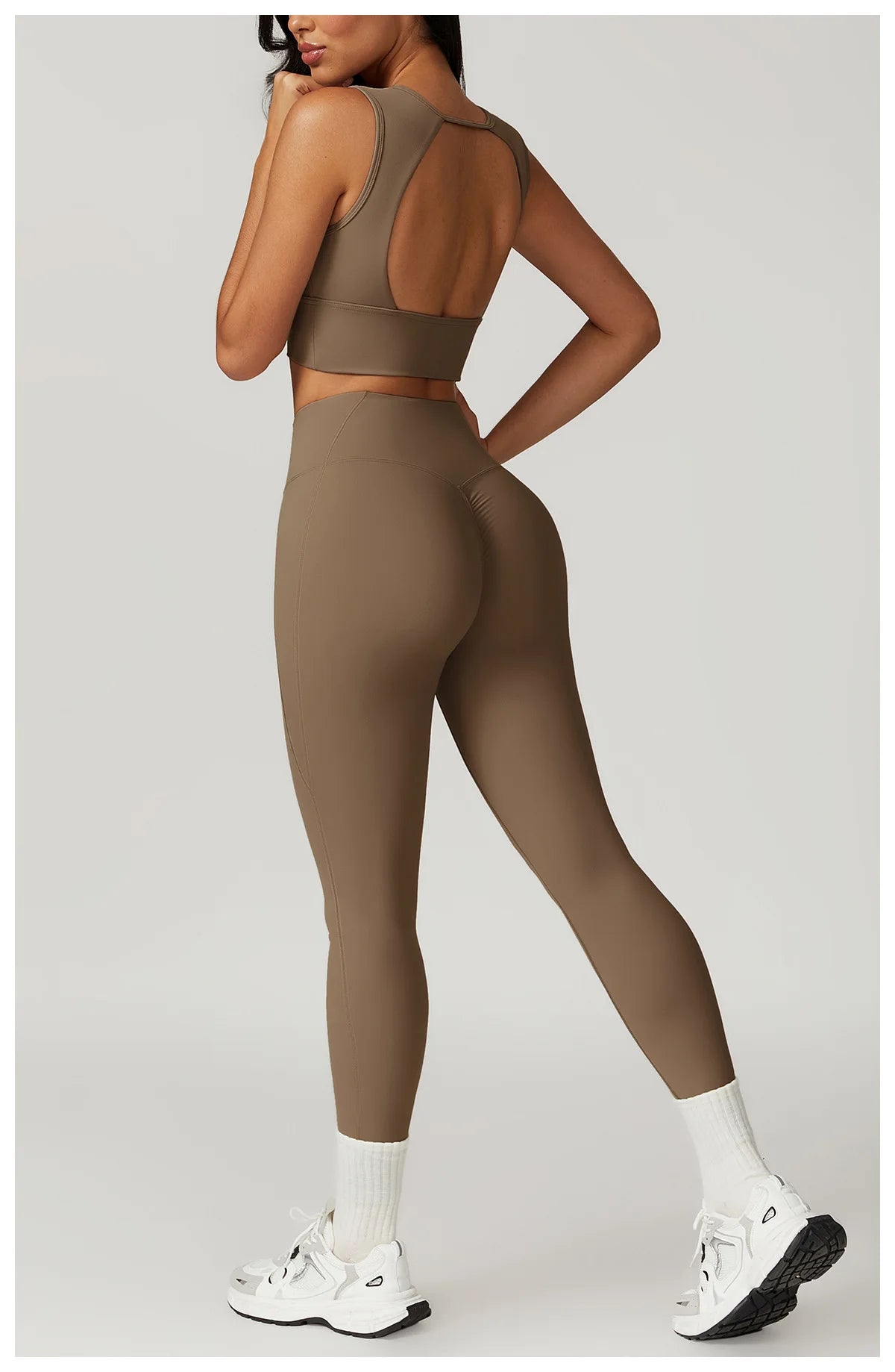 Xooie Fit women's fitness two-piece set in brown featuring a stylish crop top and high-waisted leggings