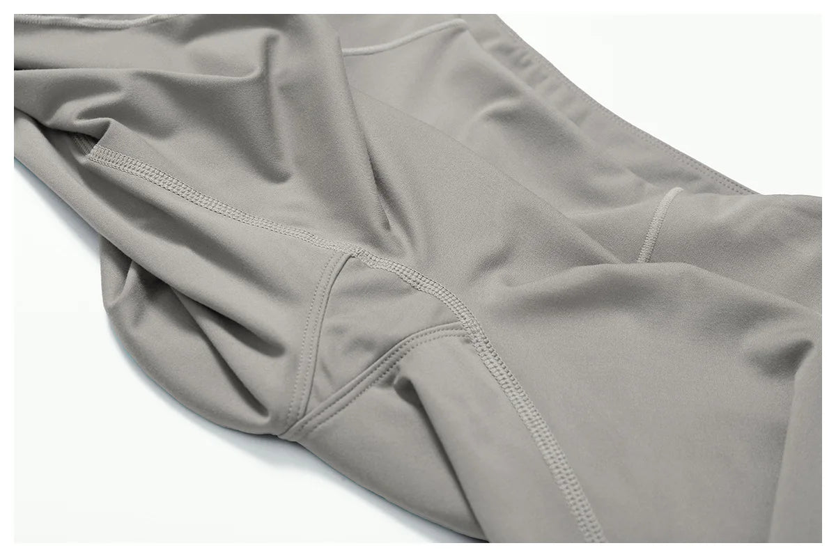 Women's fitness two-piece set in soft grey fabric, ideal for workouts and casual wear