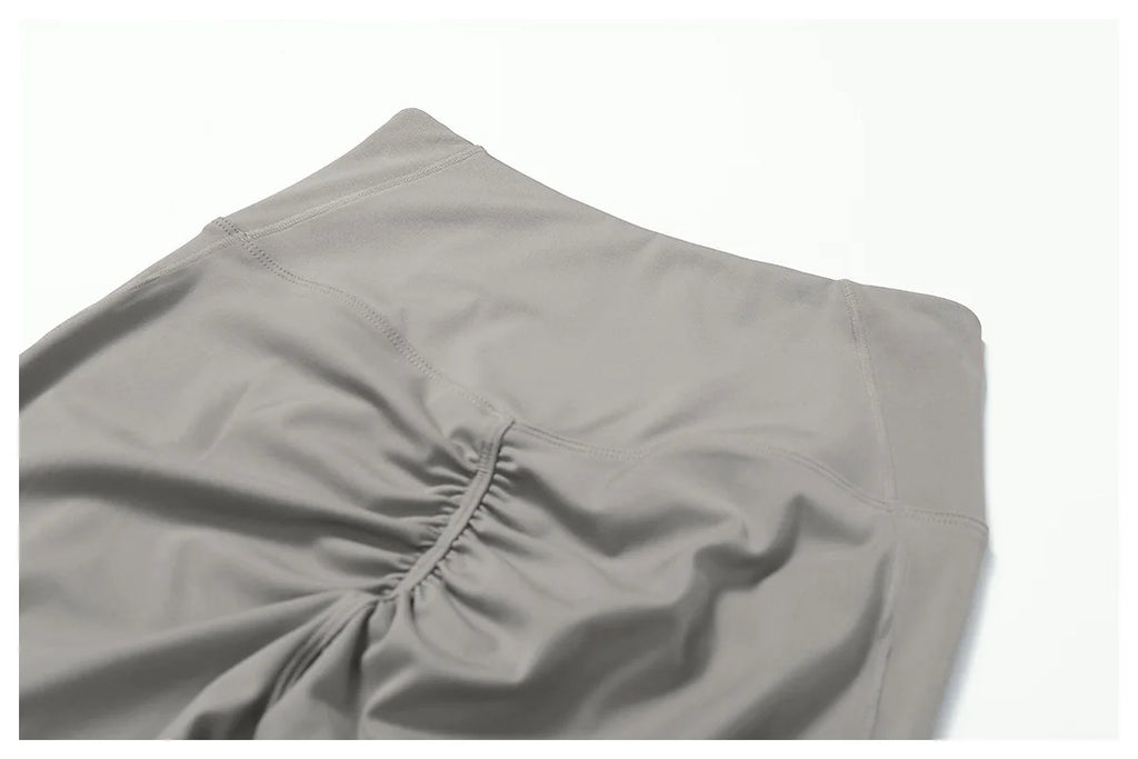 Women's fitness two-piece set in soft grey fabric, ideal for workouts and casual wear pants