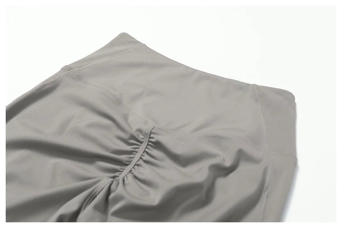 Women's fitness two-piece set in soft grey fabric, ideal for workouts and casual wear pants