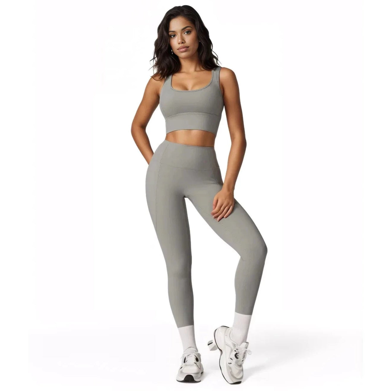 Stylish women's fitness two-piece set in gray, featuring a sports bra and high-waisted leggings