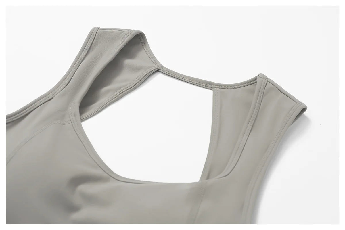 Women's fitness two-piece set in soft grey fabric, ideal for workouts and casual wear bra