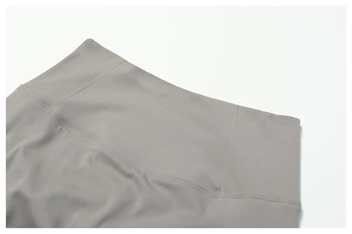 Women's fitness two-piece set in light gray featuring comfortable, stretchy fabric for active lifestyle