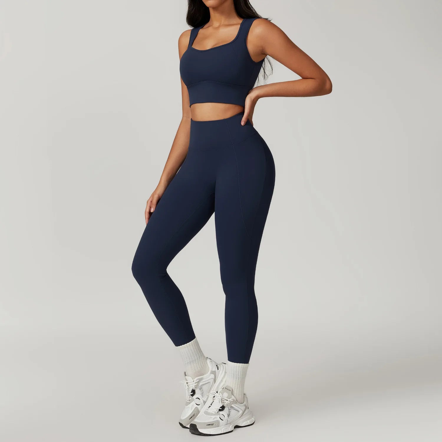 Xooie Fit women's fitness two-piece set in navy with crop top and high-waisted leggings