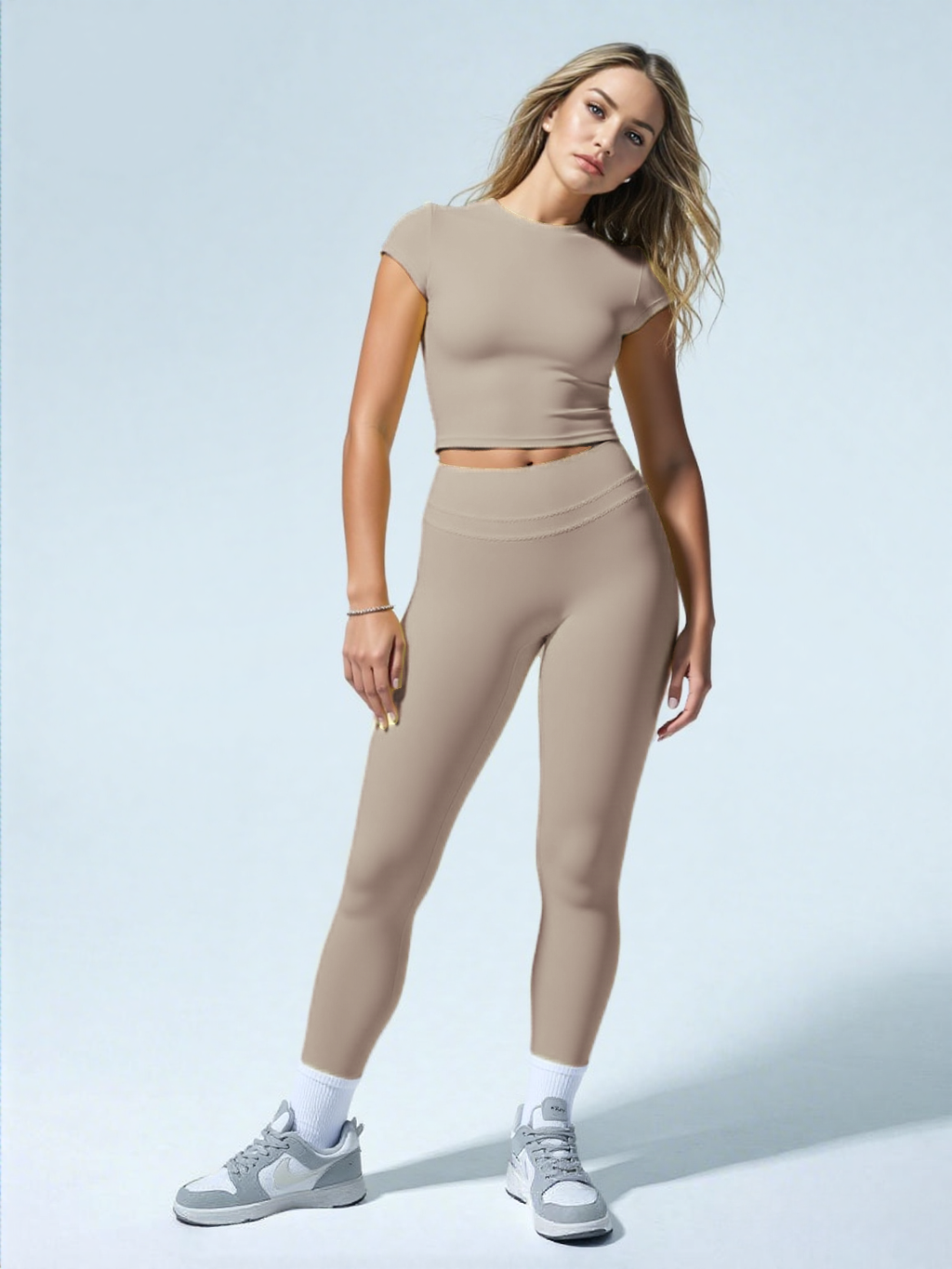 Xooie Fit women's fitted activewear set in beige with short sleeve crop top and high-waist leggings