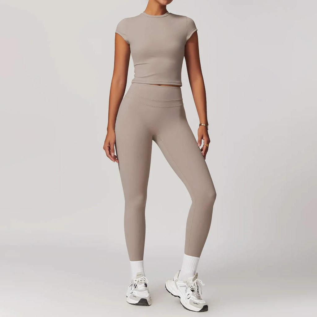Xooie Fit women's fitted activewear set in beige with high-waisted leggings and cropped sleeve top