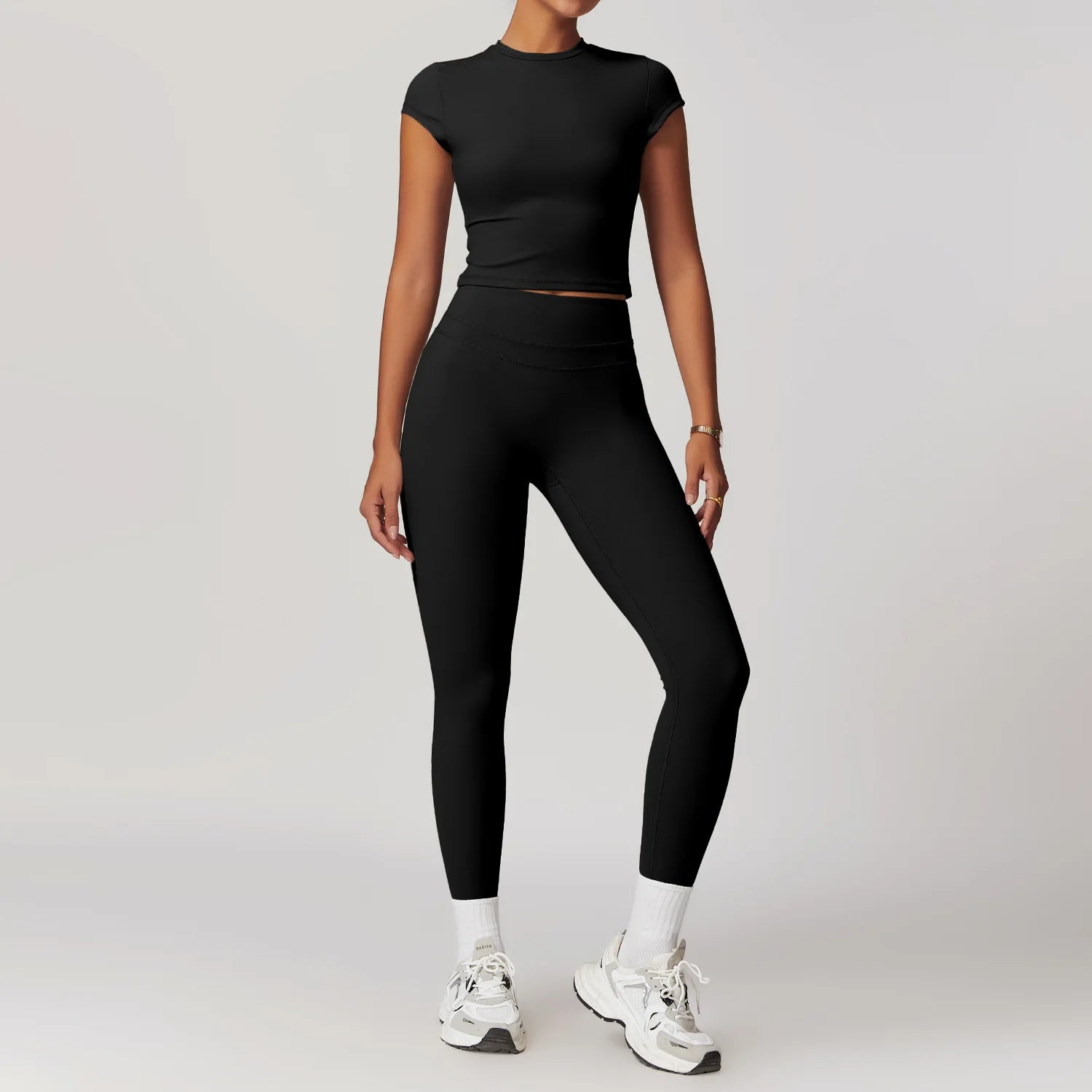 Xooie Fit women's fitted activewear set in black with short sleeve crop top and high-waisted leggings