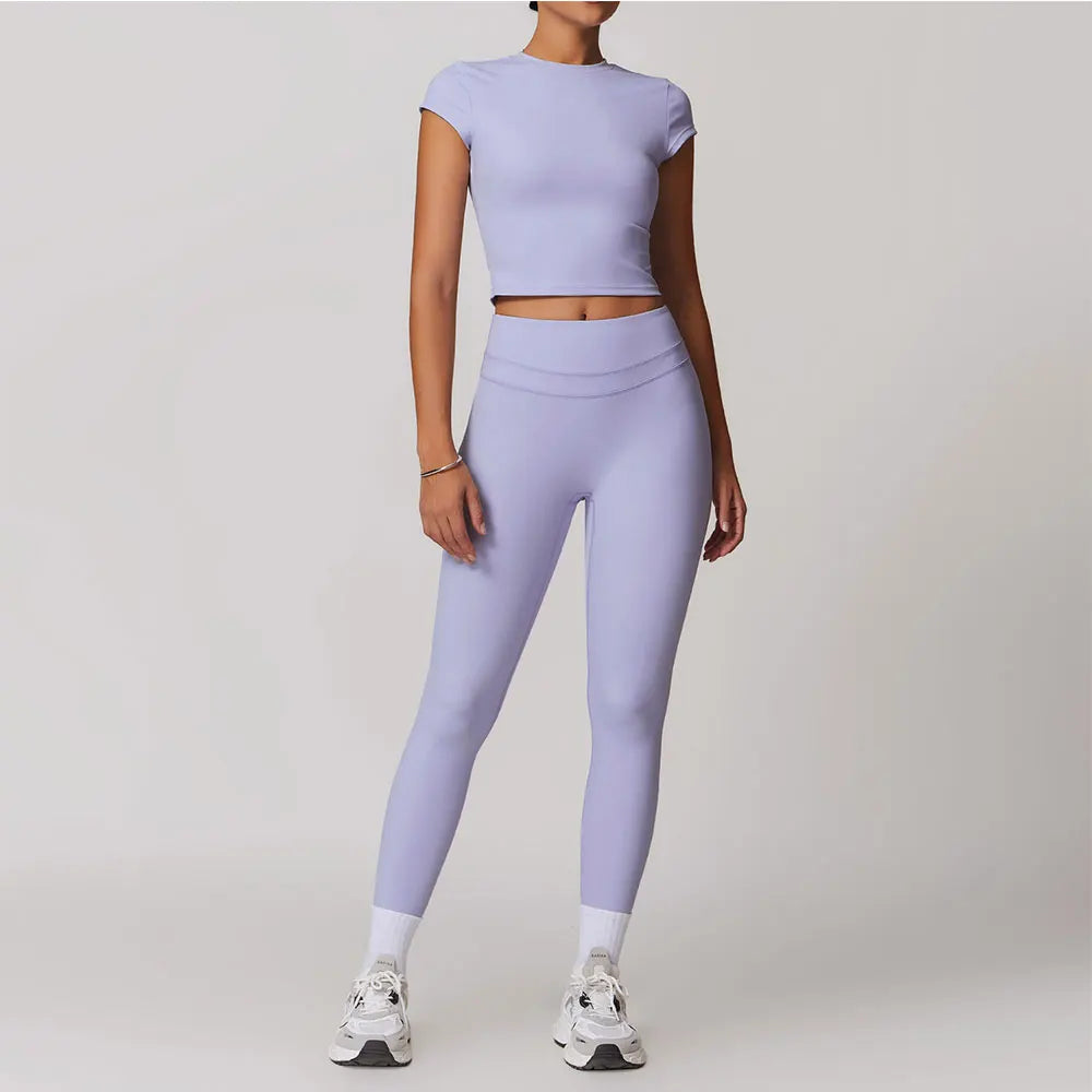 Xooie Fit women's fitted activewear set in light purple with crop top and high-waisted leggings