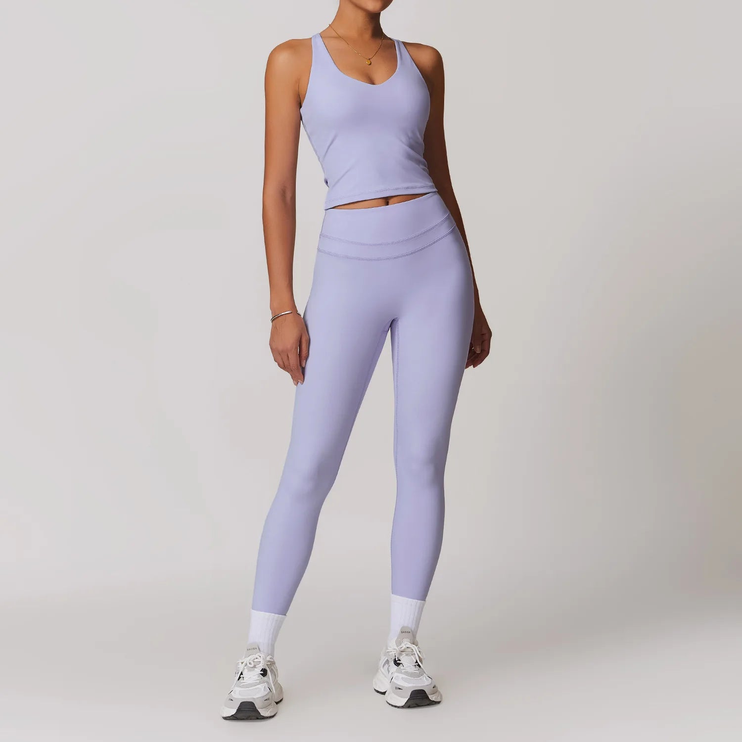 Xooie Fit lavender women's fitted activewear set with high-waisted leggings and sleeveless top