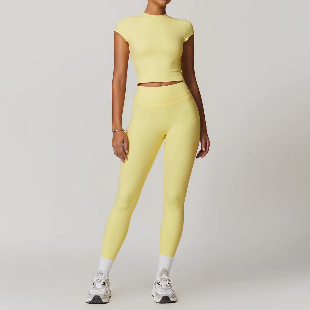 Xooie Fit women's fitted activewear set in yellow with high-waisted leggings and short sleeve crop top