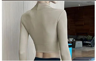 Xooie Fit Women's Fitted Activewear Top in beige, perfect for workouts and casual wear